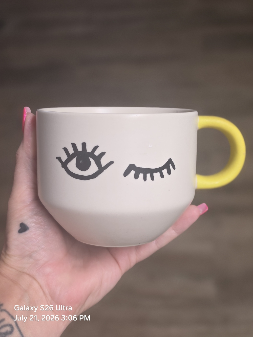 Starbucks Cream Ceramic Mug with Yellow Handle and Eye Graphic